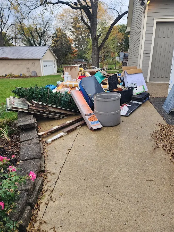 Dumpster being loaded with debris for Roofing Dumpster Rental in La Palma